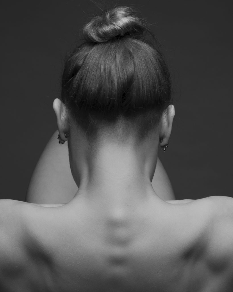 black and white photograph of the back of a woman's head